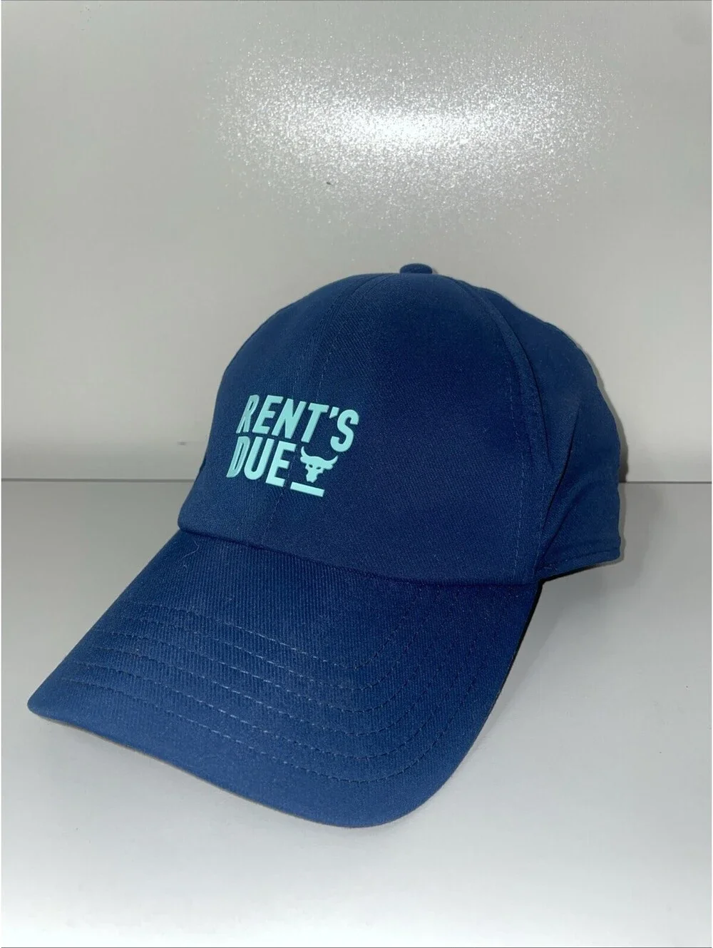 “Project Rock ‘Rent’s Due’ Hat - Dwayne Johnson Under Armour Bull Logo Navy Cap”
